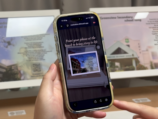 Student scanning AR marker to explore Loyang View Secondary School heritage gallery powered by qiksense.
