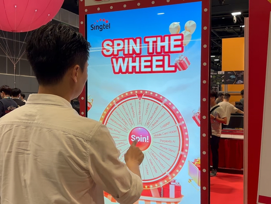 Singtel Spin the Wheel interactive campaign built using qiksense for event booths.